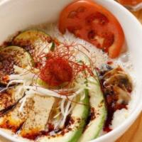 Taka'S Vegan Ramen · Vegetable broth with soy milk, wavy flat flour noodles, fried tofu, avocado, zucchini, tomat...