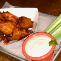 Buffalo Wings · Our signature hot sauce served with Choice of Dressing & celery.
