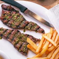 Chimichurri Steak · Steak topped with our homemade chimichurri sauce.served with a side of coleslaw and fries.
