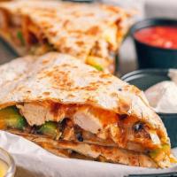 Quesadilla · Cheddar cheese onion and green peppers. served on a signature 12 inch garlic and herb tortil...