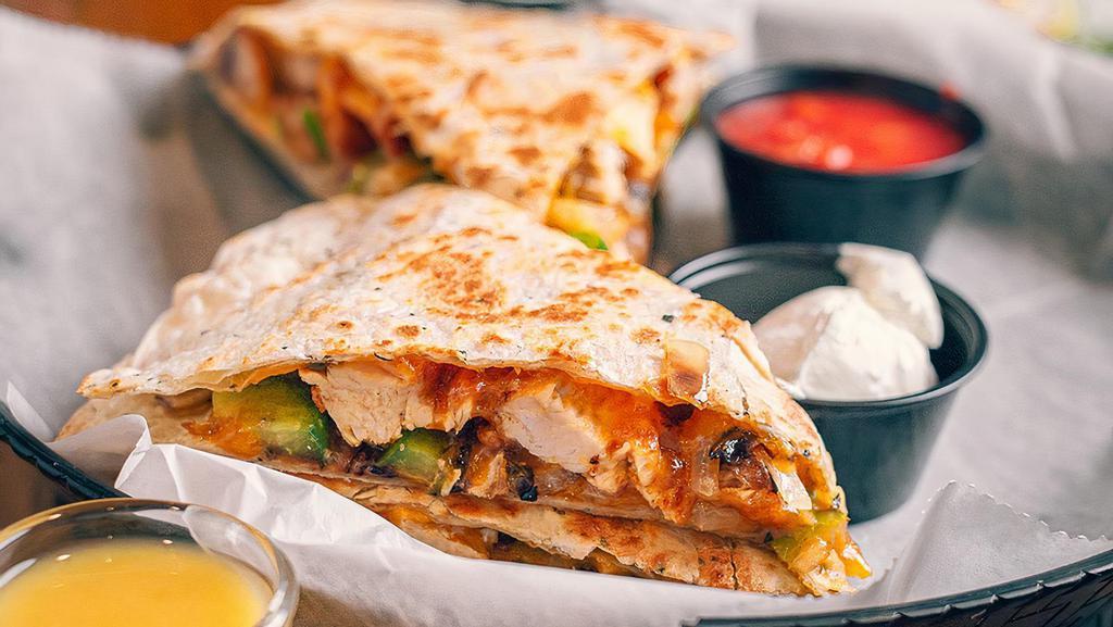 Quesadilla · Cheddar cheese onion and green peppers. served on a signature 12 inch garlic and herb tortilla with sour cream and salsa. add protein for extra charge
