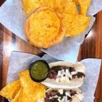 Street Tacos · Grilled skirt steak onions and homemade chimichurri sauce. served with chips and salsa. 3 ta...