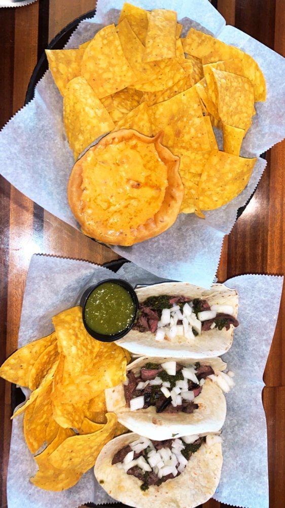 Street Tacos · Grilled skirt steak onions and homemade chimichurri sauce. served with chips and salsa. 3 tacos per order