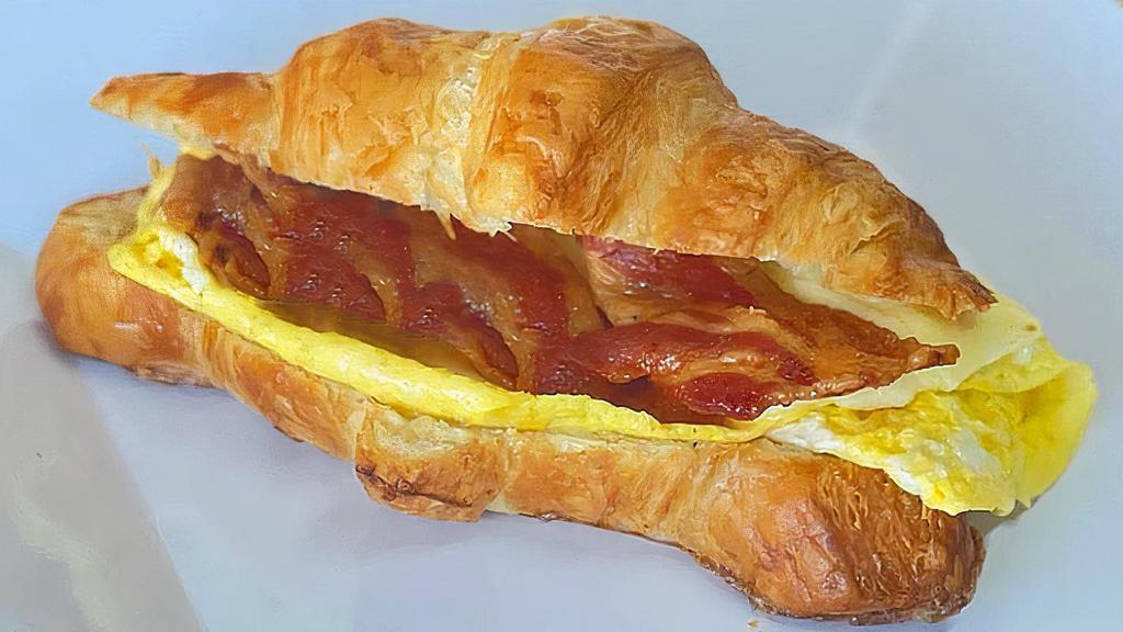 Farm Egg & Cheese On Croissant · Bring your bacon egg and cheese to a new level on Bella's croissant with our own farm fresh free range eggs.