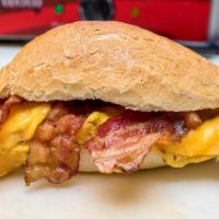 Bacon, Egg & Cheese · Grilled bacon, 2-scramble or fried eggs, yellow american cheese. Your choice-mayonnaise, ket...