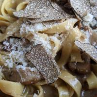 Tagliatelle · with porcini mushroom and Burgundy black truffle.