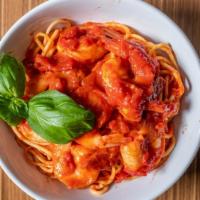 Shrimp Fra D · tender shrimp served in a spicy tomato sauce flavored with garlic & spice on a bed of spaghe...