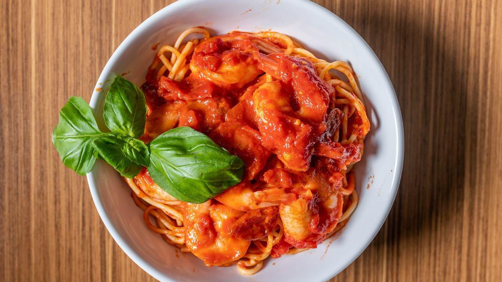 Shrimp Fra D · tender shrimp served in a spicy tomato sauce flavored with garlic & spice on a bed of spaghetti.