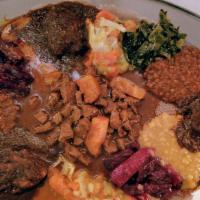 Meat Combo · Tibs Wat, Special Tibs, Doro Wat, and Beg Alicha served with three vegetable dishes of your ...