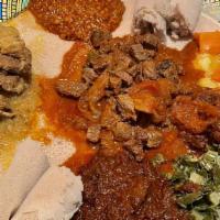 Combo 5 · Doro Wat and Beg Alicha served with three vegetable dishes of your choosing.