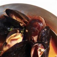 Steamed Mussels In Pomodoro · Pomodoro sauce, fresh garlic.