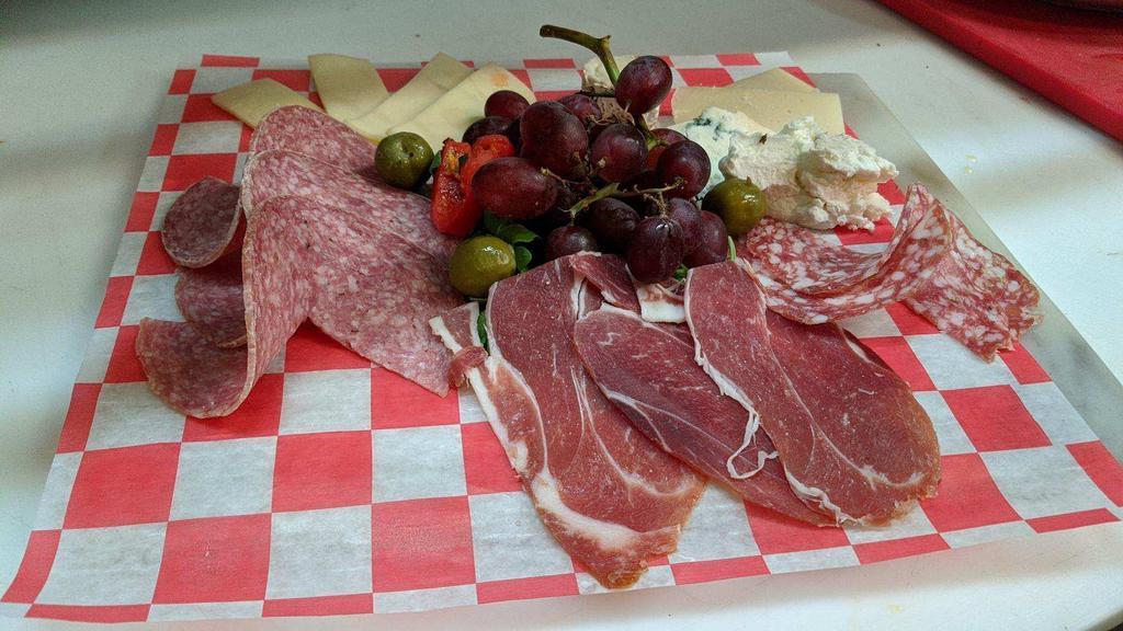 Antipasto Gennaro · Assortment of salami, prosciutto, mozzarella, provolone, parmigiana, olives and roasted peppers.