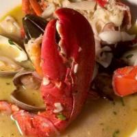 Mezze Aragosta Fra Diavolo · Half lobster with shrimp, mussels, clams, calamari, with linguini.