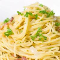 Spaghetti Alla Carbonara · Onions & prosciutto sautéed in a parmigiana-cream sauce.