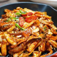 오징어 볶음 / Ojingeo Bokkeum · Spicy. Stir fried squid with vegetables in the hot sauce.
