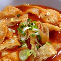 만두 떡볶이 / Mandoo Tuckbokki · Spicy. Spicy rice cake and fish cake with vegetables and deep fried dumplings.