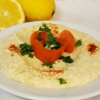 Hummus · A savory dish made from cooked, ground chickpeas blended with tahini, lemon juice, a touch o...