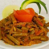 Lube (Green Beans) · Green beans slowly simmered in tomatoes sauce, diced tomatoes, onions, garlic, olive oil and...
