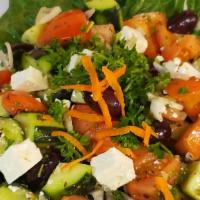 Greek Salad (Garden Salad) · Made with pieces of tomatoes, cucumbers, onion, feta cheese, olives dressed with salt, peppe...