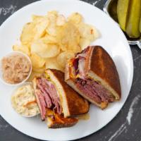 Ny Style  Reuben Feast · Steamy Pastrami, corned beef, melted Swiss, sauerkraut, coleslaw, mustard and Russian on wel...