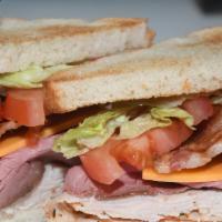 Hello Deli Club Sandwich · Turkey, roast beef, bacon, cheddar, lettuce, tomato, and Russian on toast.