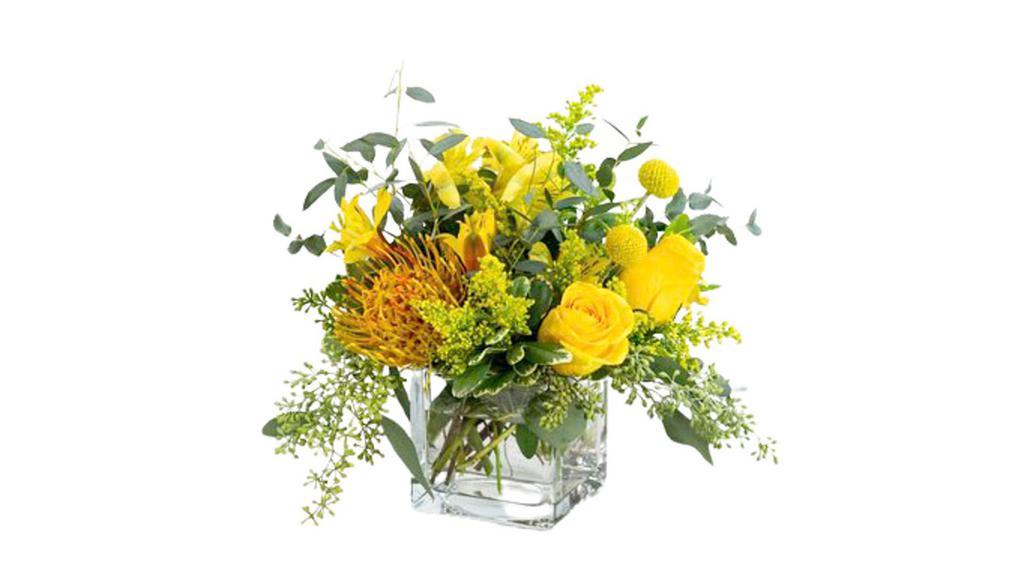 Belle De Jour · Belle De jour means beauty of the day. This magnificent and bright Design is thoughtfully arranged with yellow roses, alstroemeria, pincushion protea, craspedia, and solidago, accented with varieties of eucalyptus. This beauty is sure to make someone's day or week, as it will have long-lasting blooms, brightening their home or office space.