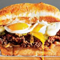 Sultan Of Swat Burger · ½ Pound Burger, Cheddar Cheese, Fried Egg, Lettuce, Tomato, Uptown Sauce on a Brioche Bun.