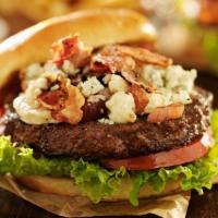 Bleu Burger · 1/2 pound burger, cajun seasoning, blue cheese crumbles, lettuce, tomato, uptown sauce on a ...
