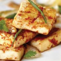 Spicy Tofu Steak · Tofu, scallions, and cilantro grilled in a special spicy homemade sauce.