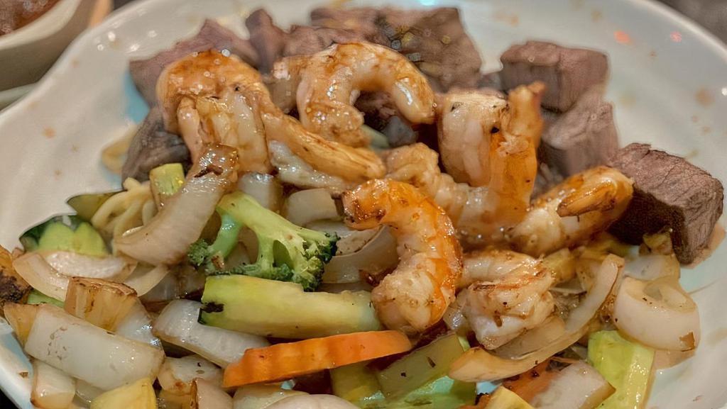 Filet Mignon & Shrimp · Served with mushroom soup, green salad, hibachi shrimp (cooked together) hibachi vegetables, and white rice.