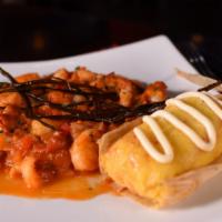 Tamalito Matiz · Cheese corn dough tamale, topped with sour cream and chives served with shrimp in coconut to...