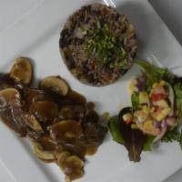 Teres Major · Bistro steak in a demi glace mushroom sauce, served with gallo pinto: mixed rice. and black ...