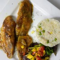 Tilapia Al Limón · Pan seared tilapia fillet in white wine lemon sauce, served with vegetable rice and house sa...