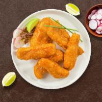 Buffalo Wild Tenders · Chicken tenders fried until golden brown before being tossed in buffalo sauce. Served with y...