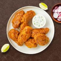 Hometown Honey Mustard Wings · Fresh chicken wings fried and tossed in honey mustard sauce. Served with your choice of dipp...