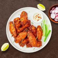 Rollin' Ranch Wings · Fresh chicken wings fried and tossed in classic BBQ Sauce. Served with your choice of dippin...
