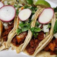 Tacos · Corn Tortillas, Choice of meat, and onion and cilantro on top