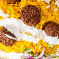 Falafel Over Rice  · Served with Falafel  , rice , homemade salads, white sauce & hot sauce on plate