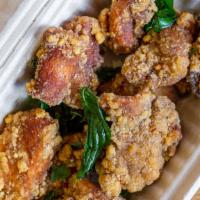 Taiwanese Popcorn Chicken · Bite-sized juicy chunks of fried chicken. Served with fried basil and your choice of dipping...