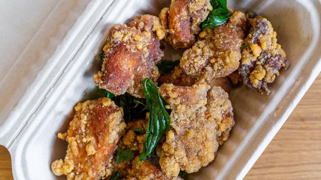 Taiwanese Popcorn Chicken · Bite-sized juicy chunks of fried chicken. Served with fried basil and your choice of dipping sauce.  One order comes with nine pieces.