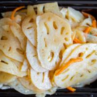 Pickled Lotus Roots · Blanched lotus root slices and shredded carrots, pickled in a rice vinegar brine.