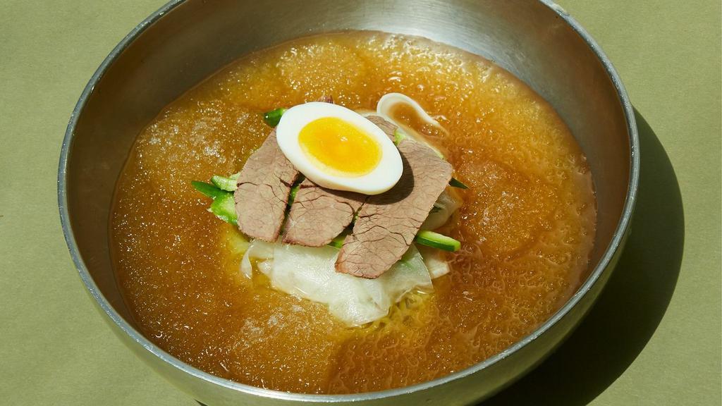 Icy 냉면 · Chilled noodles in an iced broth bath with slivered boiled beef, cucumbers, daikon, and egg. Traditionally served with buckwheat noodles.