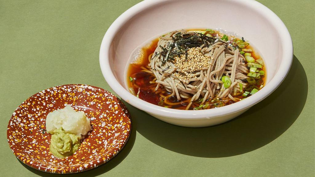 Chilled Soba 모밀국수 · Served in a light soy dipping sauce with green onions, grated daikon, and wasabi on the side.