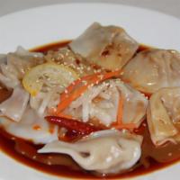 Szechuan Dumplings · Eight pieces.