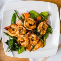 Grilled Lemongrass Shrimp · Hot & spicy. Marinated jumbo prawns sautéed with Asian greens with
curry sauce on the side.