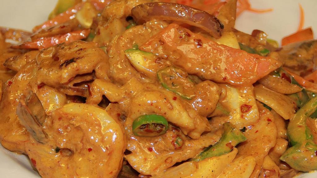 Curry Chicken & Shrimp Thai Style · Hot & spicy. Sliced chicken and jumbo shrimp cooked in coconut milk with coriander, turmeric, fennel seeds and lemon grass.