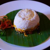 Erachi Puttu (Chicken) · Rice flour, chicken and grated coconut steamed in coconut shell.