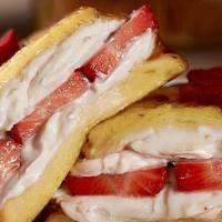 Stuffed Strawberry Cream Cheese French Toast · Two Thick slices of French toast stuffed with strawberry cream cheese and topped with fresh ...