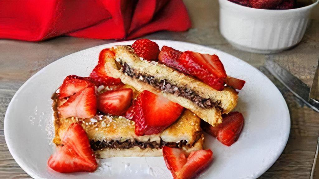 Stuffed Nutella French Toast · Two Thick slices French toast stuffed with Nutella® and topped with sliced strawberries.