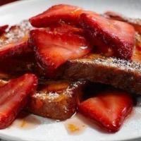 Strawberry French Toast · Two Thick slices of French toast with strawberries.